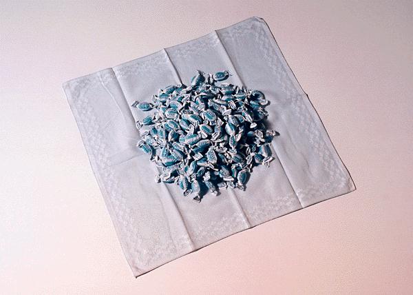 Felix Gonzales-Torres. 1991. "Untitled (Throat)."
      Handkerchief, candy wrapped in blue cellophane