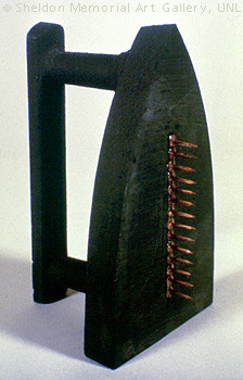 Man Ray. 1921 (fabricated 1974). "Cadeau." Cast iron, tacks